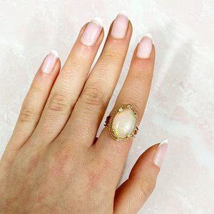Oval Opal Twisted Rose Gold Halo Ring