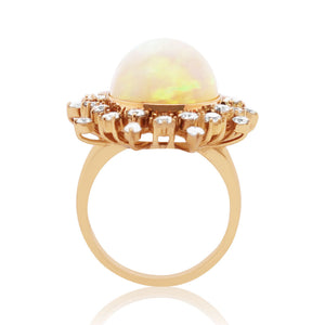 Beautiful Snowflake Opal Ring adorned with diamonds in rose gold setting 